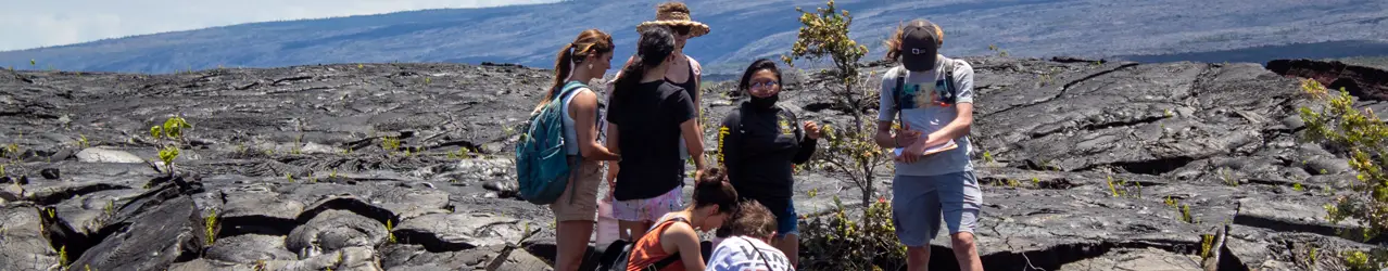 Measuring lava tree molds at Kalapana